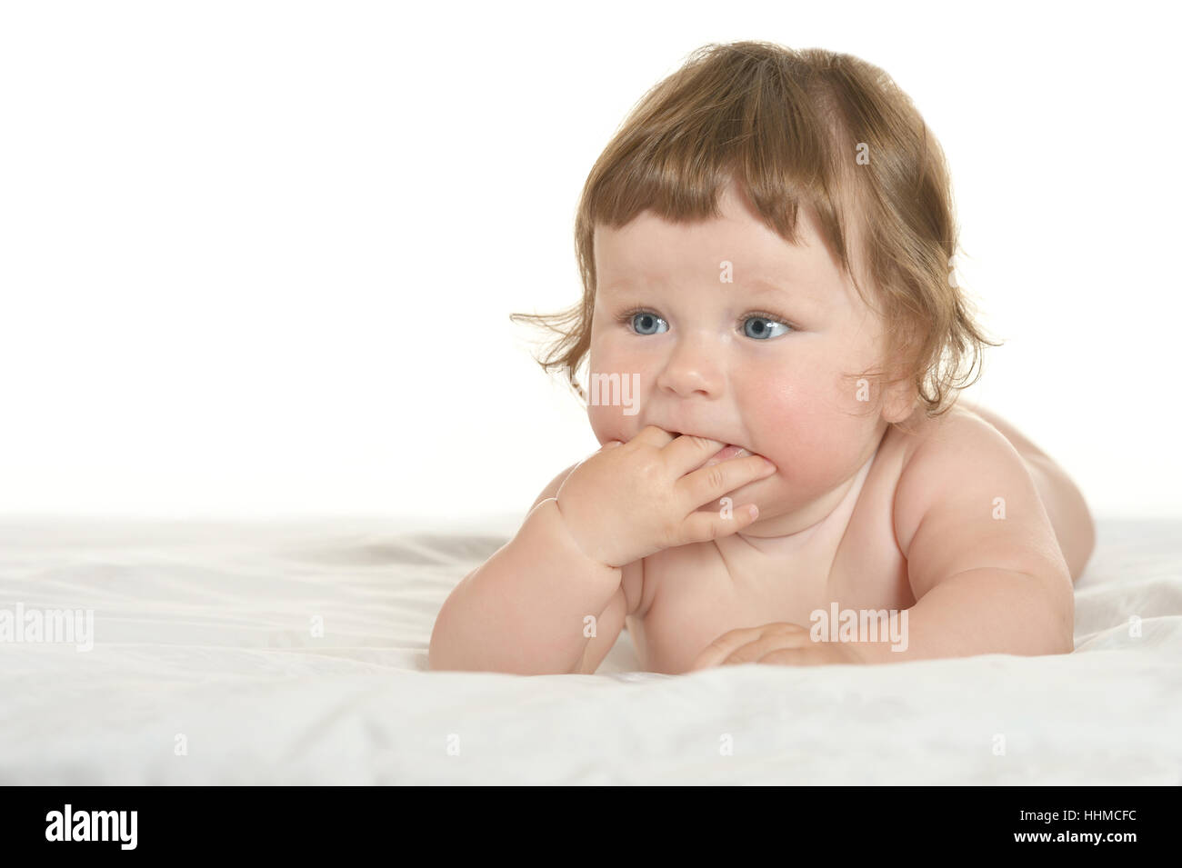 Adorable baby girl on blanket on a white background Stock Photo - Alamy