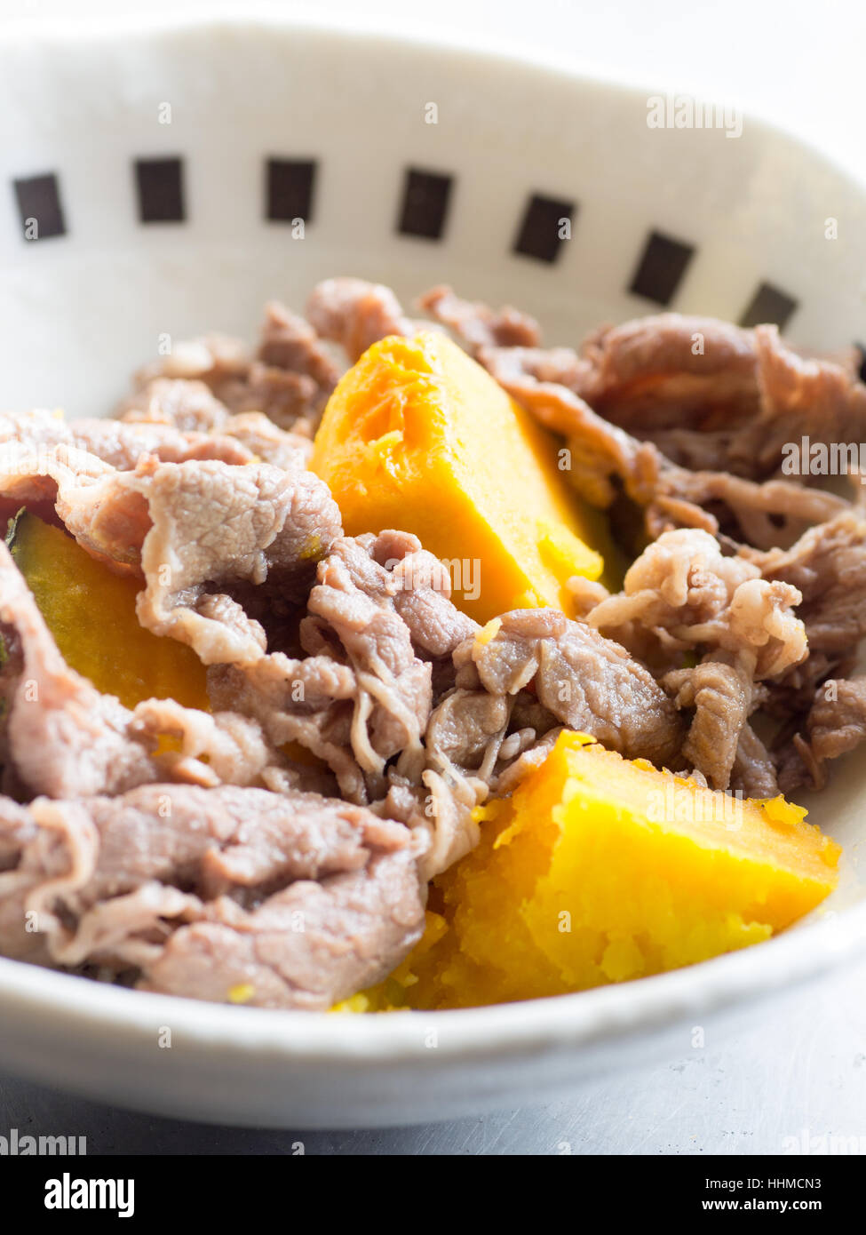 Japanese cuisine, simmered lean beef and pumpkins in the bowl Stock Photo