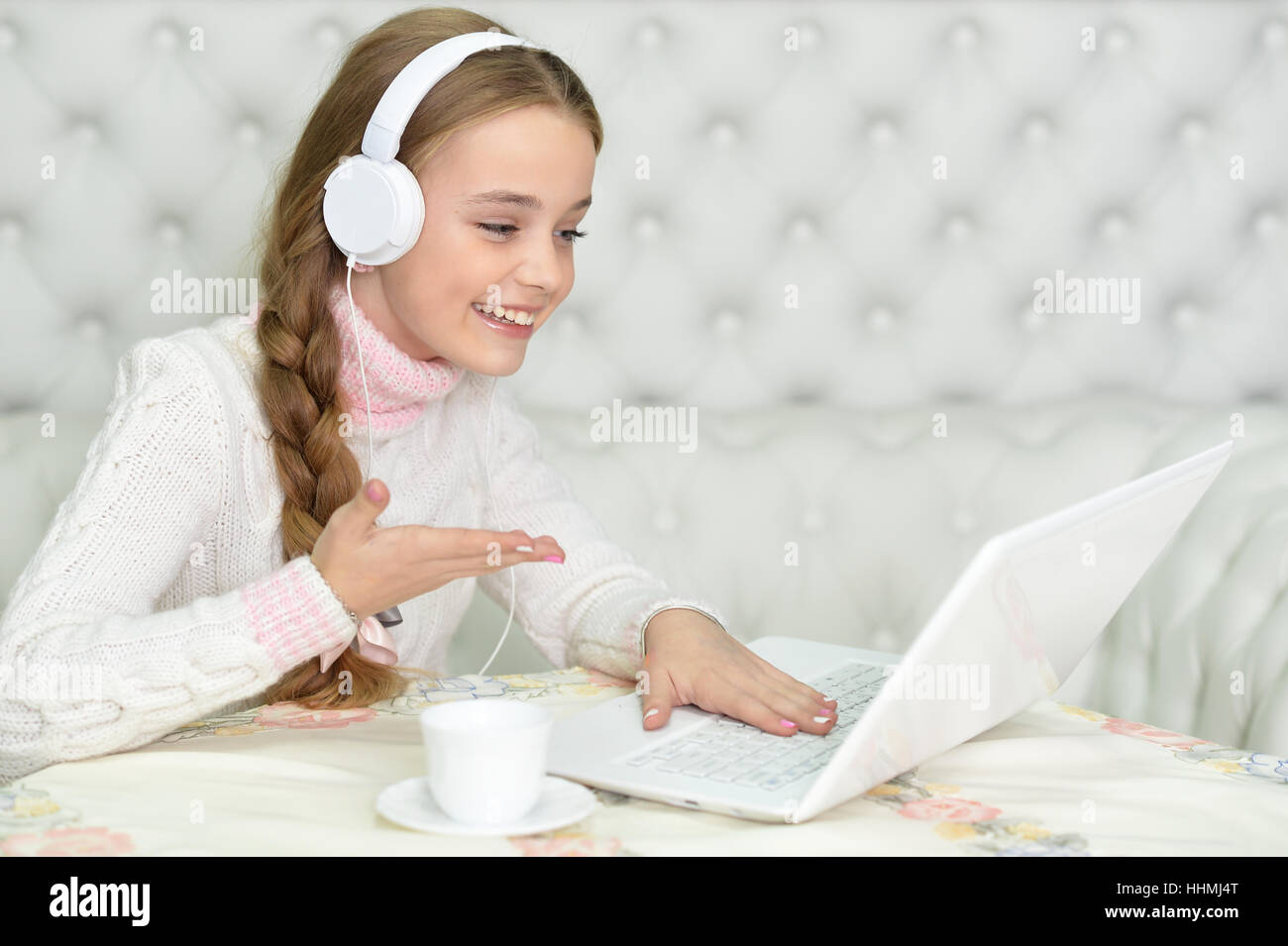 Preteen girl with laptop Stock Photo - Alamy