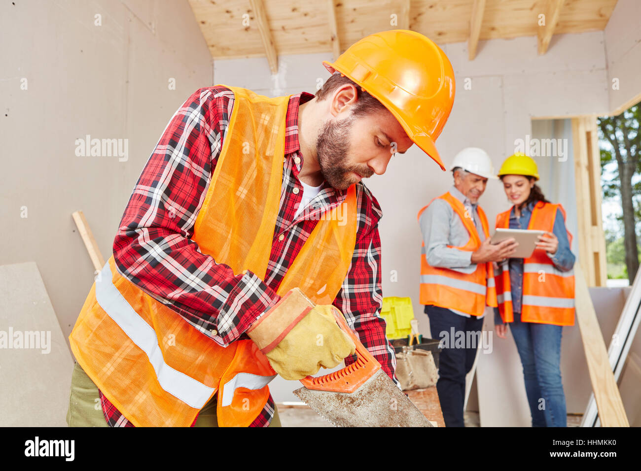 Skilled carpenter working with wood with concentration Stock Photo