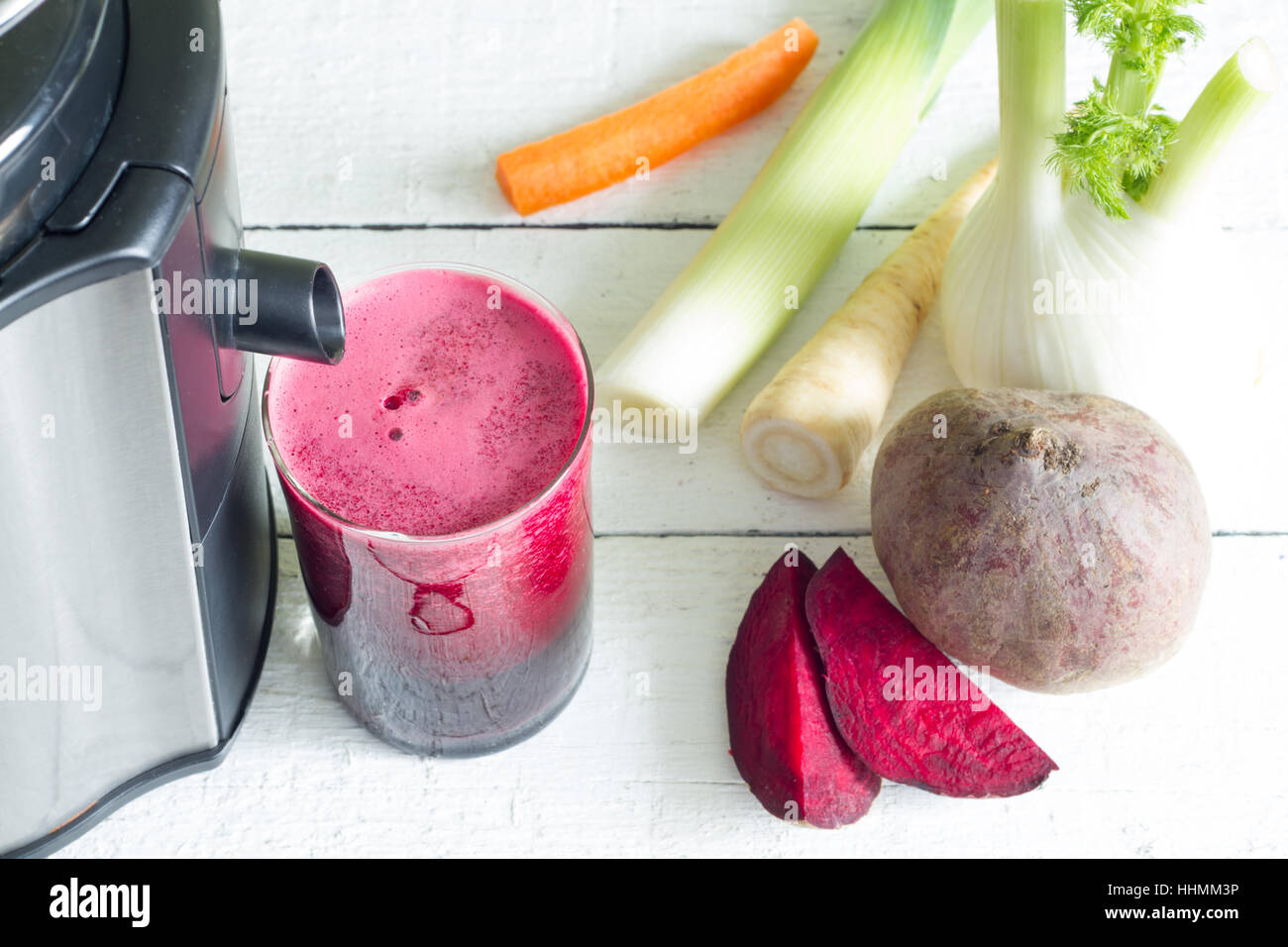 Juicer, red beetroot juice, other vegetables health diet detoxification concept Stock Photo