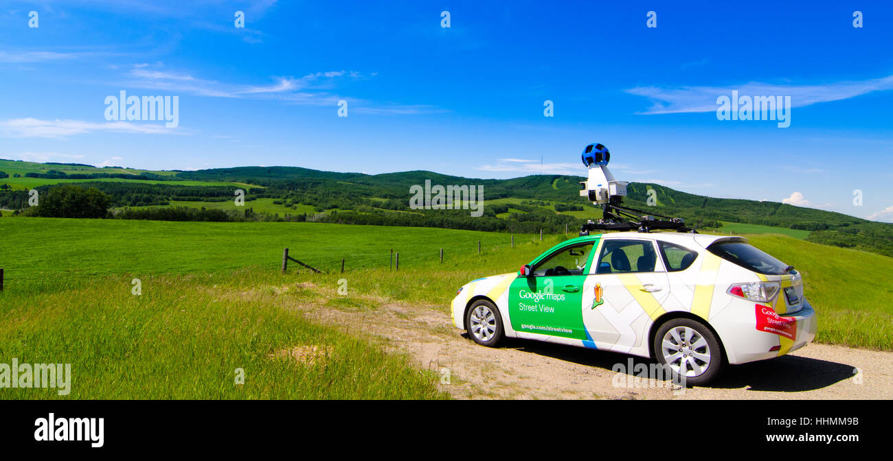 Google streetview car looking into a valley and field. Stock Photo