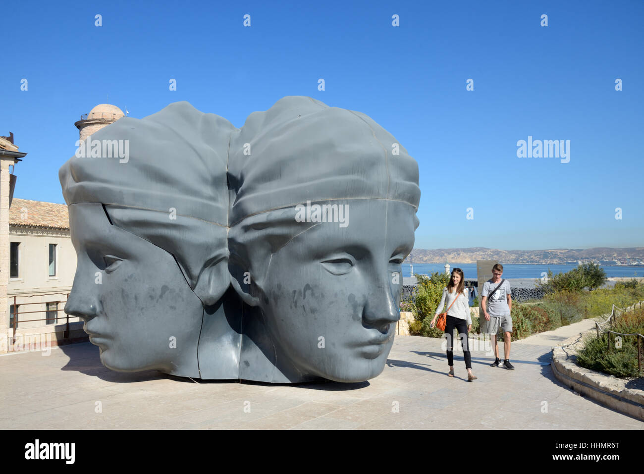 Fort Saint Jean Giant Face Sculpture & Young Visitors Marseille. The historic Fort Saint Jean is part of the MUCEM Museum Complex Stock Photo