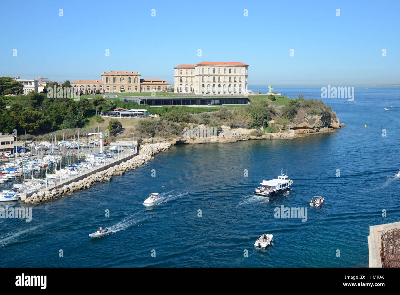 Marseille Entrance to the Vieux Port with the Pharo Palace and Pleasure Boats Entering or Leaving the Harbour Marseille France Stock Photo