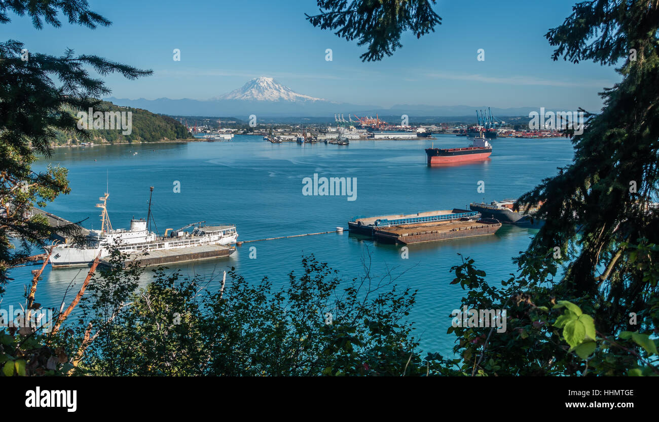 A panoramic shot of the Port of Tacoma with majestic Mount Rainier in ...