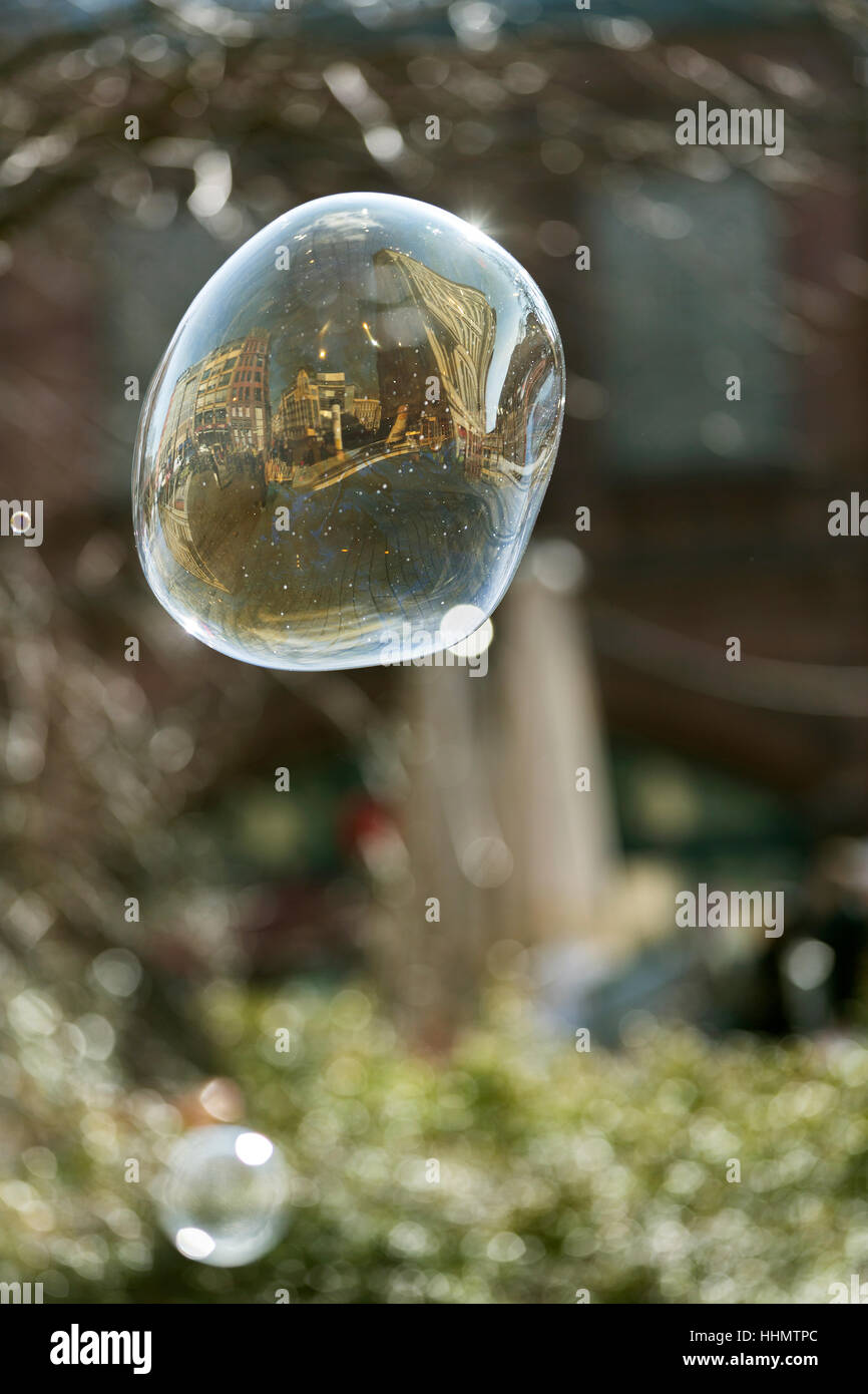 Housing reflected in a soap bubble, Hackescher Markt square, Berlin, Germany Stock Photo