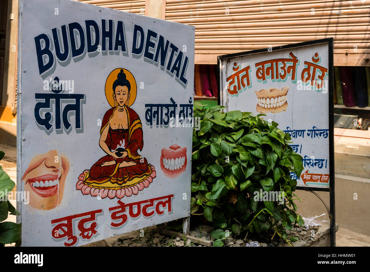 Dentist advertisement Buddha Dental at a signpost, Kathmandu, Kathmandu District, Nepal Stock Photo