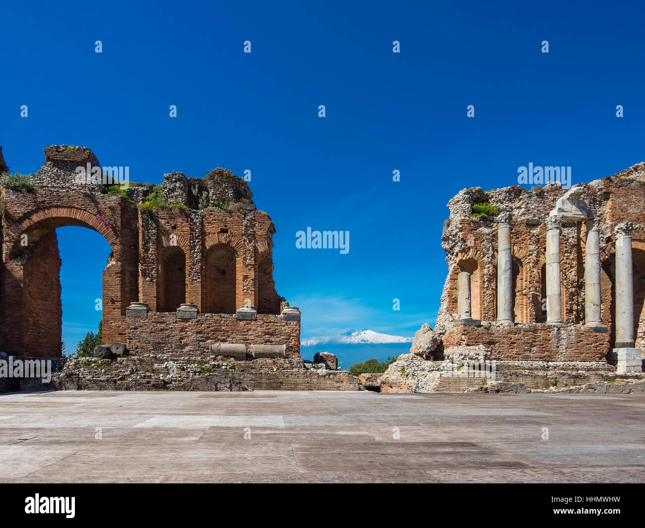 Amphitheatre ruins, Teatro Antico di Taormina, Taormina, Sicily, Italy Stock Photo