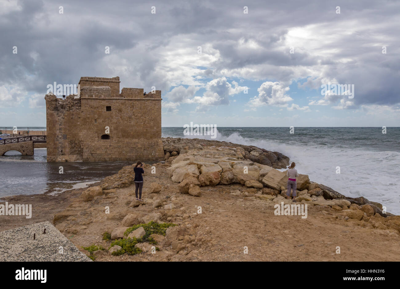 Paphos castle on a stormy day.  Stormy summer's day with cloudy sky and crashing waves. Stock Photo