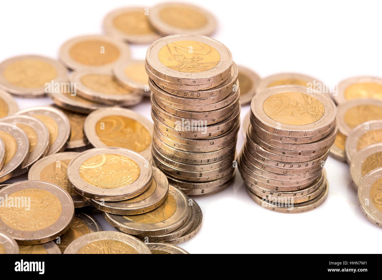 Heap of two euro coins isolated on white background Stock Photo - Alamy