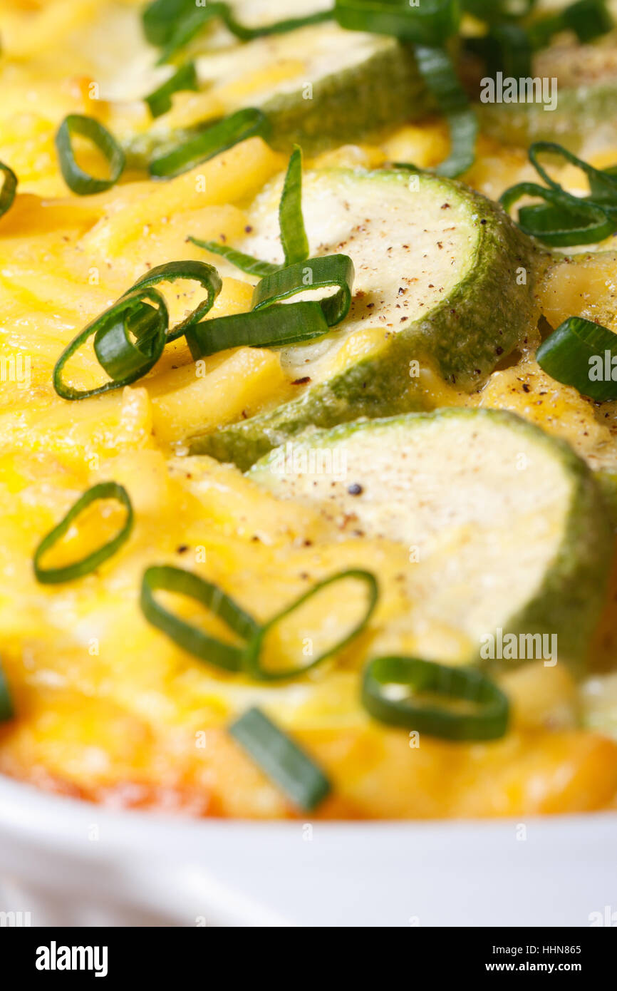 Baked zucchini, eggs, onion and cheese macro vertical Stock Photo Alamy