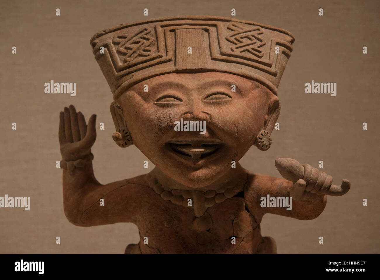 Sonrientes figurine in Remojadas style called 'smiling' figure exhibited at the Metropolitan Museum of Art in New York City. Stock Photo