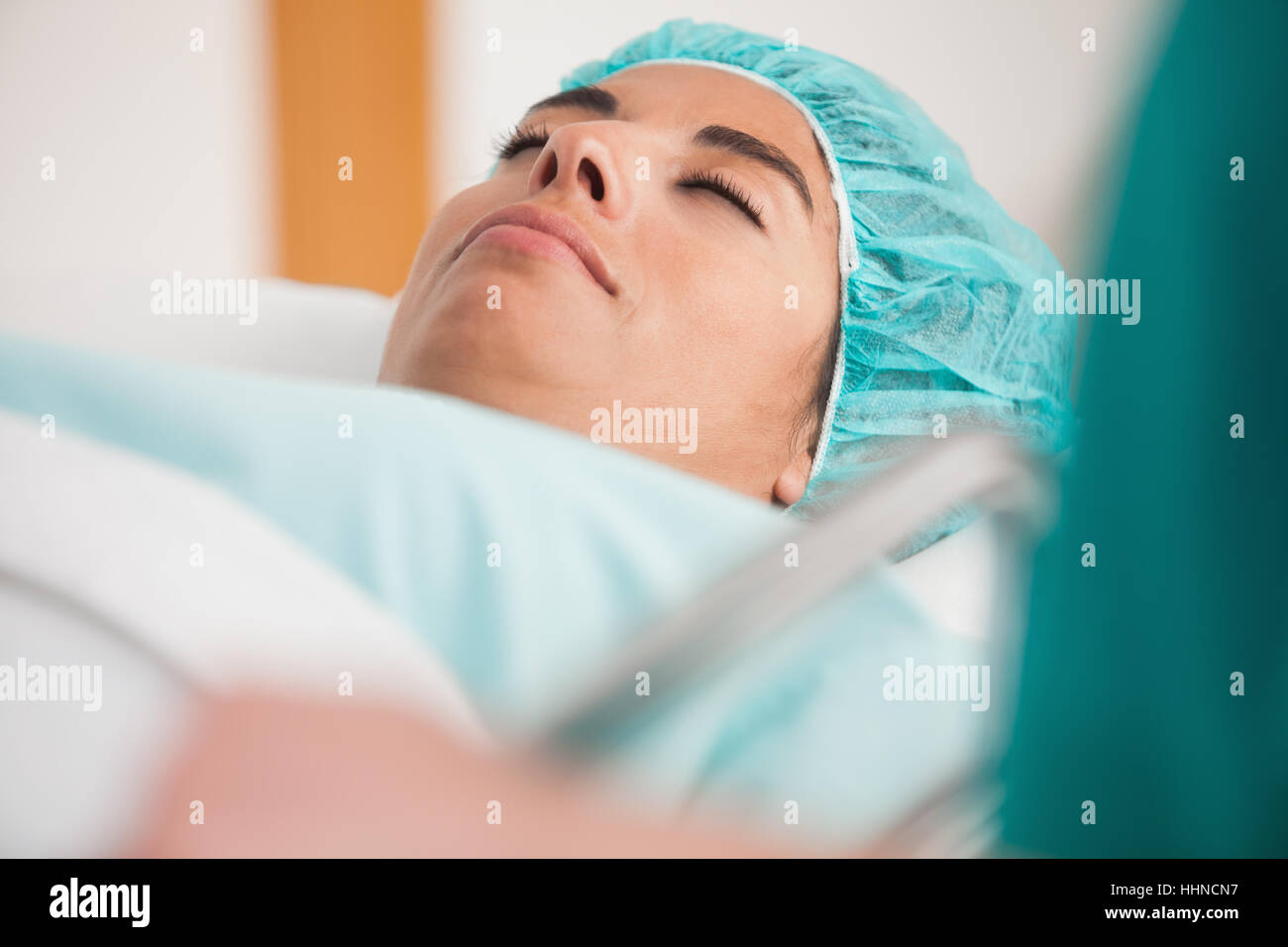 Patient lying on gurney before surgery in hospital corridor Stock Photo