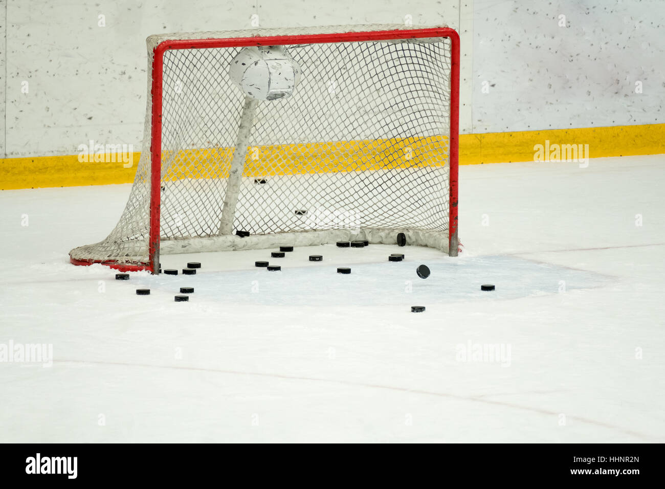 Many pucks in the hockey gates Stock Photo Alamy