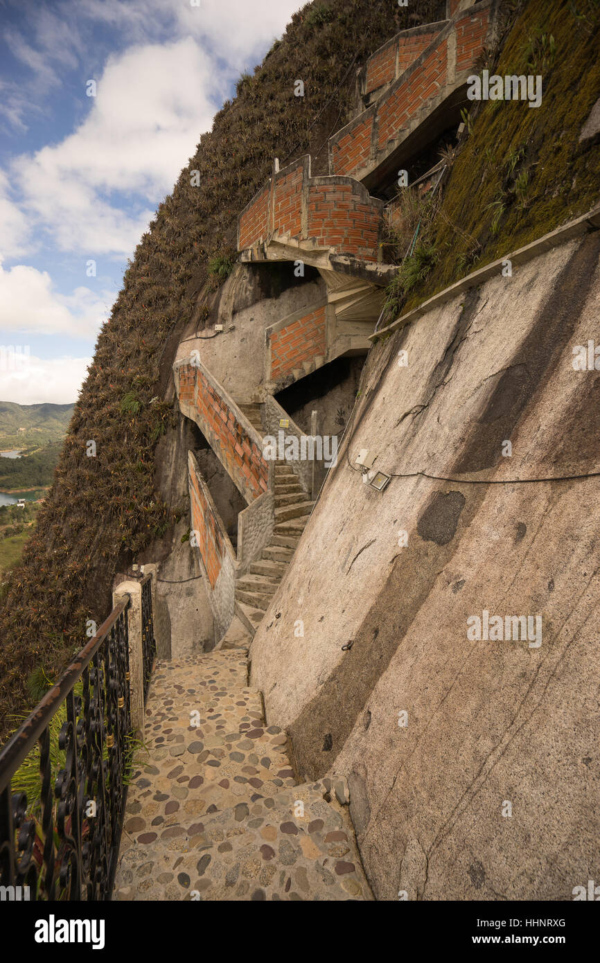 Stairs climb the granite rock cliff at Penon de Guatape Colombia Stock Photo