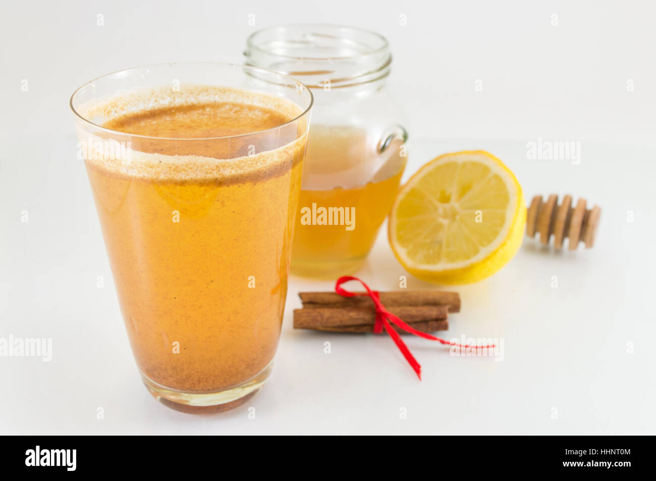 honey lemon and cinnamon drink on white background Stock Photo