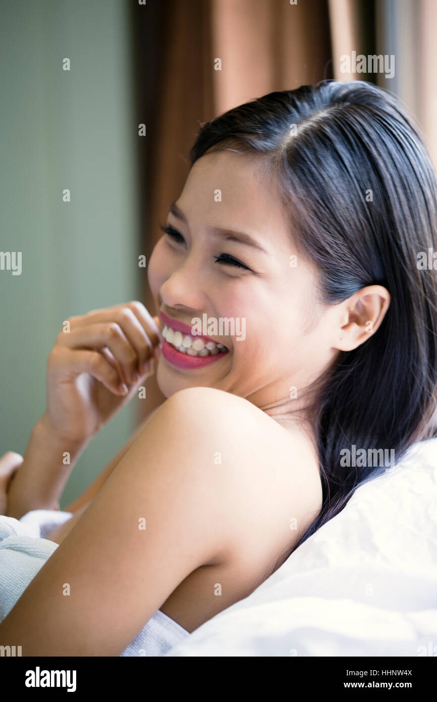 Portrait of laughing Asian teenage girl Stock Photo