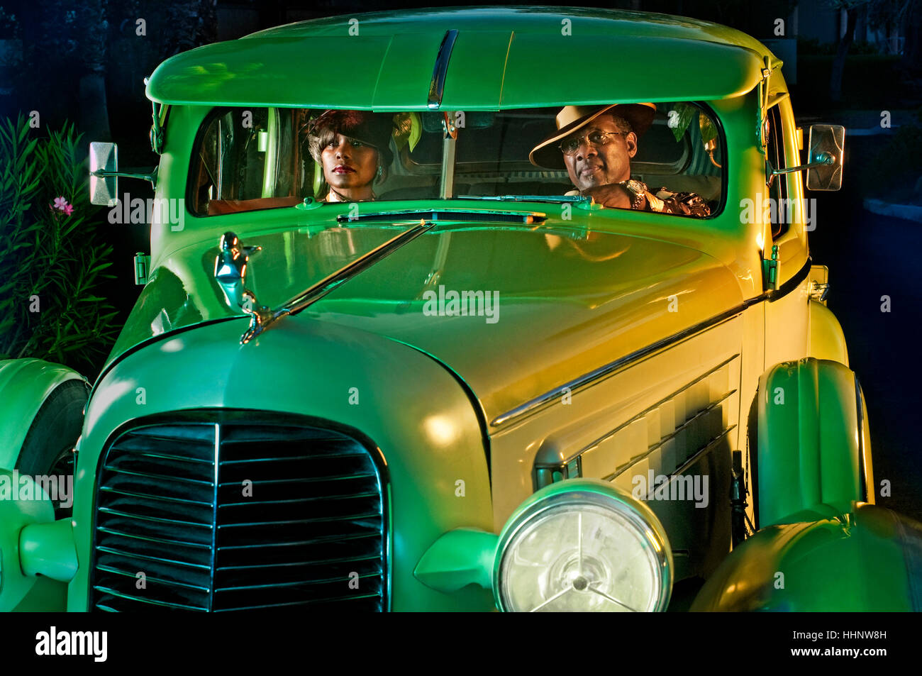 Couple in green vintage car Stock Photo