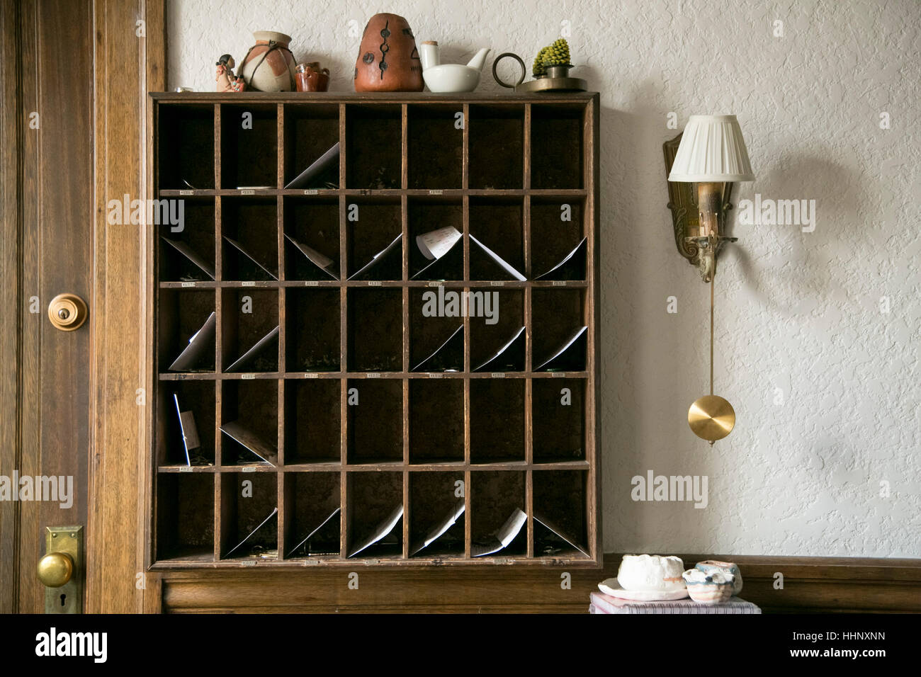 Messages in wooden slots in hotel Stock Photo