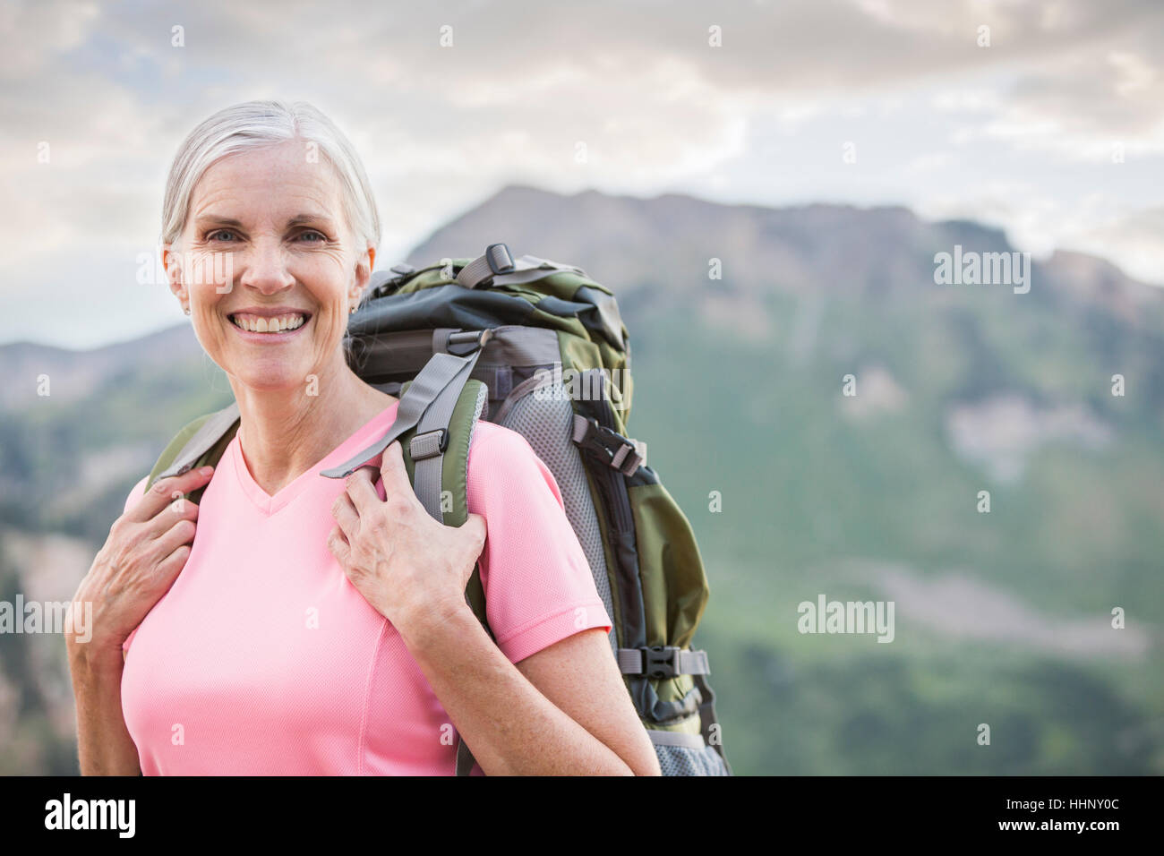Caucasian woman hiking on mountain Stock Photo - Alamy