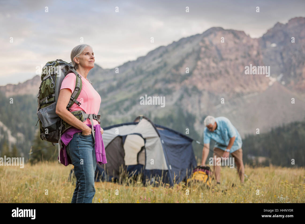 Caucasian couple camping on mountain Stock Photo