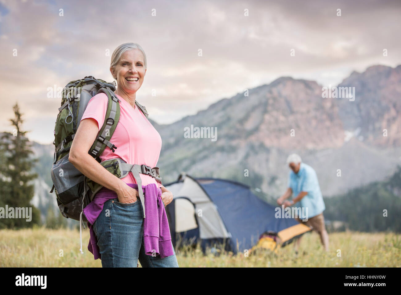 Caucasian couple camping on mountain Stock Photo