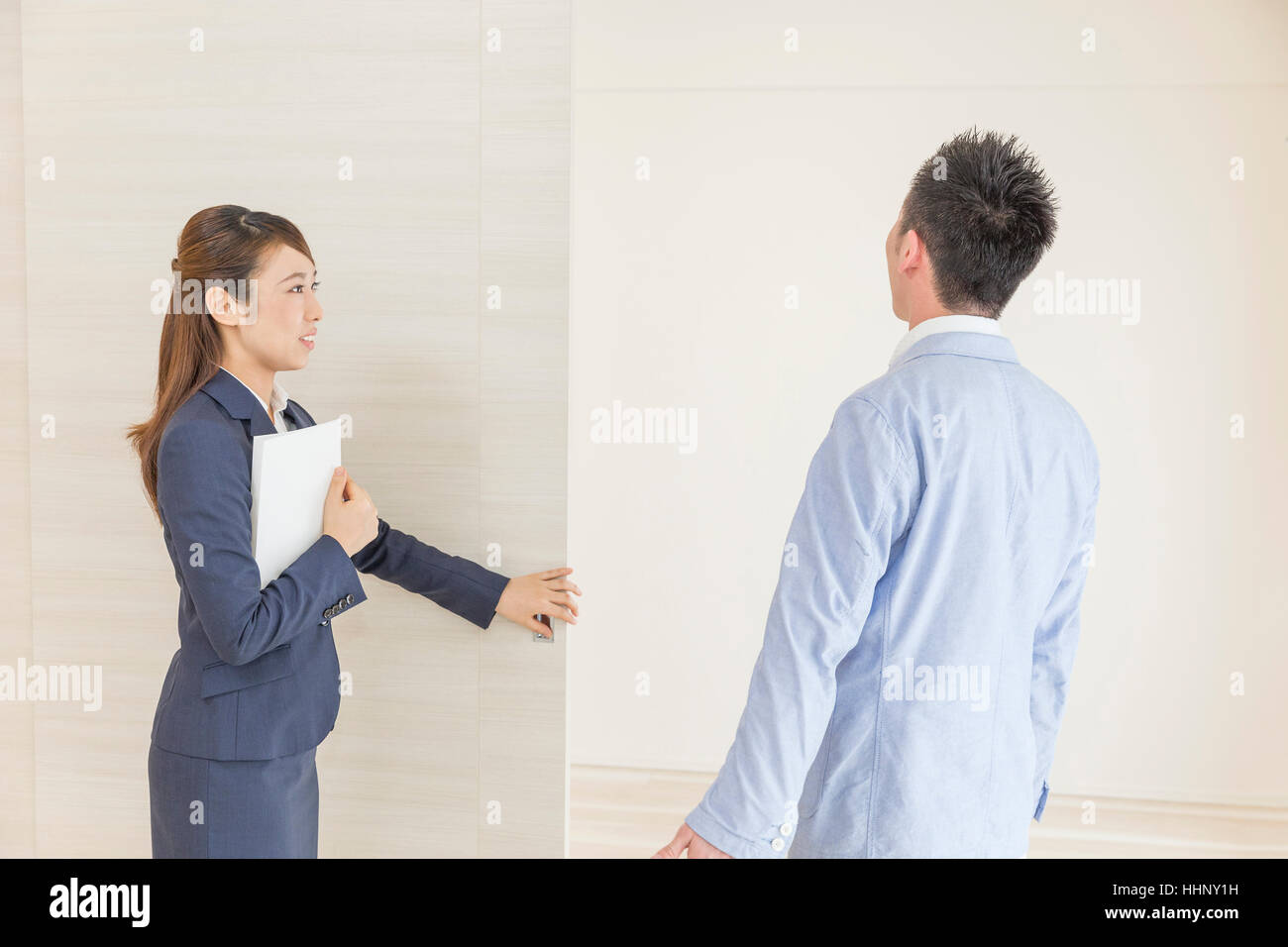 Real Estate Agent Showing Room to Buyer Stock Photo