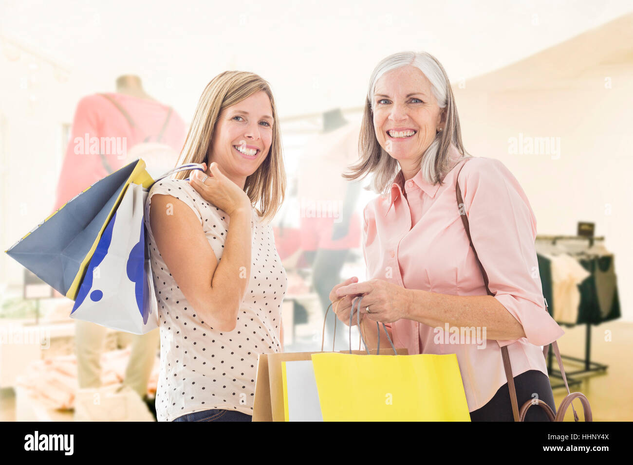 Portrait of Caucasian women holding shopping bags Stock Photo - Alamy