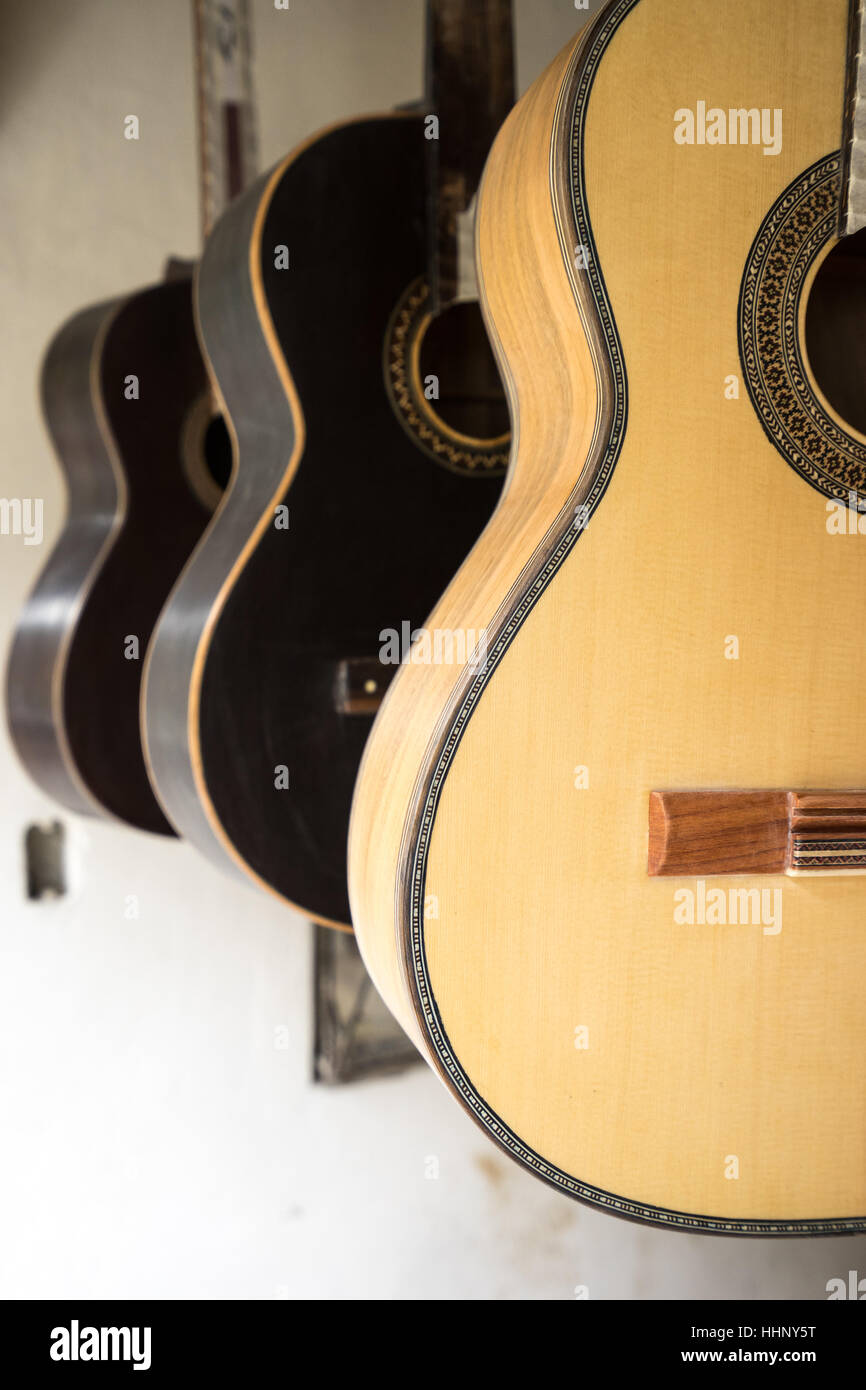 guitars hanging in luthiers shop in San Bartolome Ecuador Stock Photo