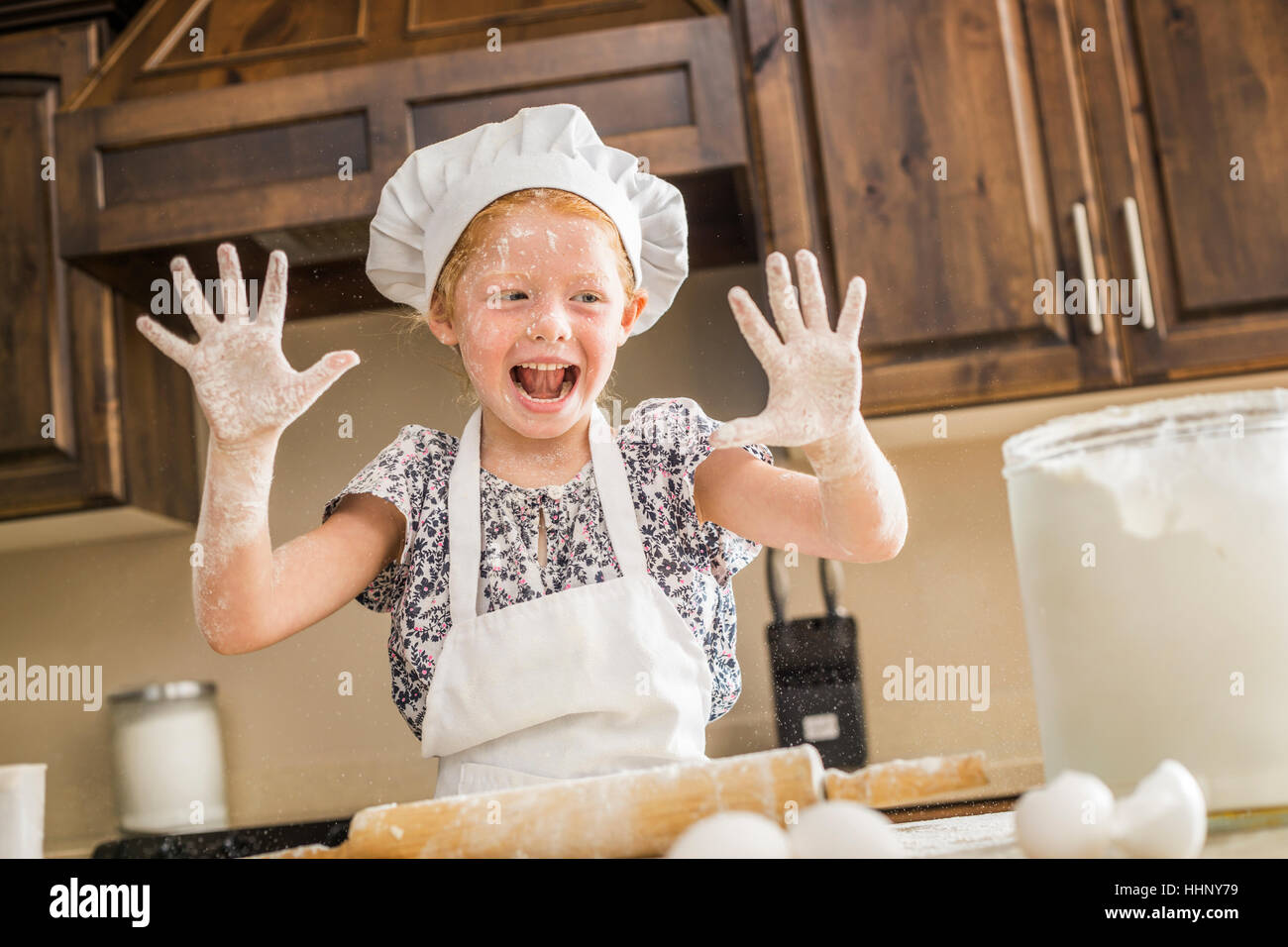 Caucasian girl covered in flour Stock Photo Alamy
