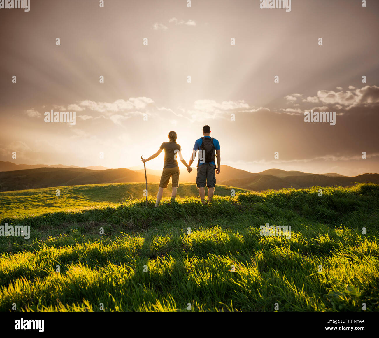 View of couple holding hands at sunset hi-res stock photography and ...