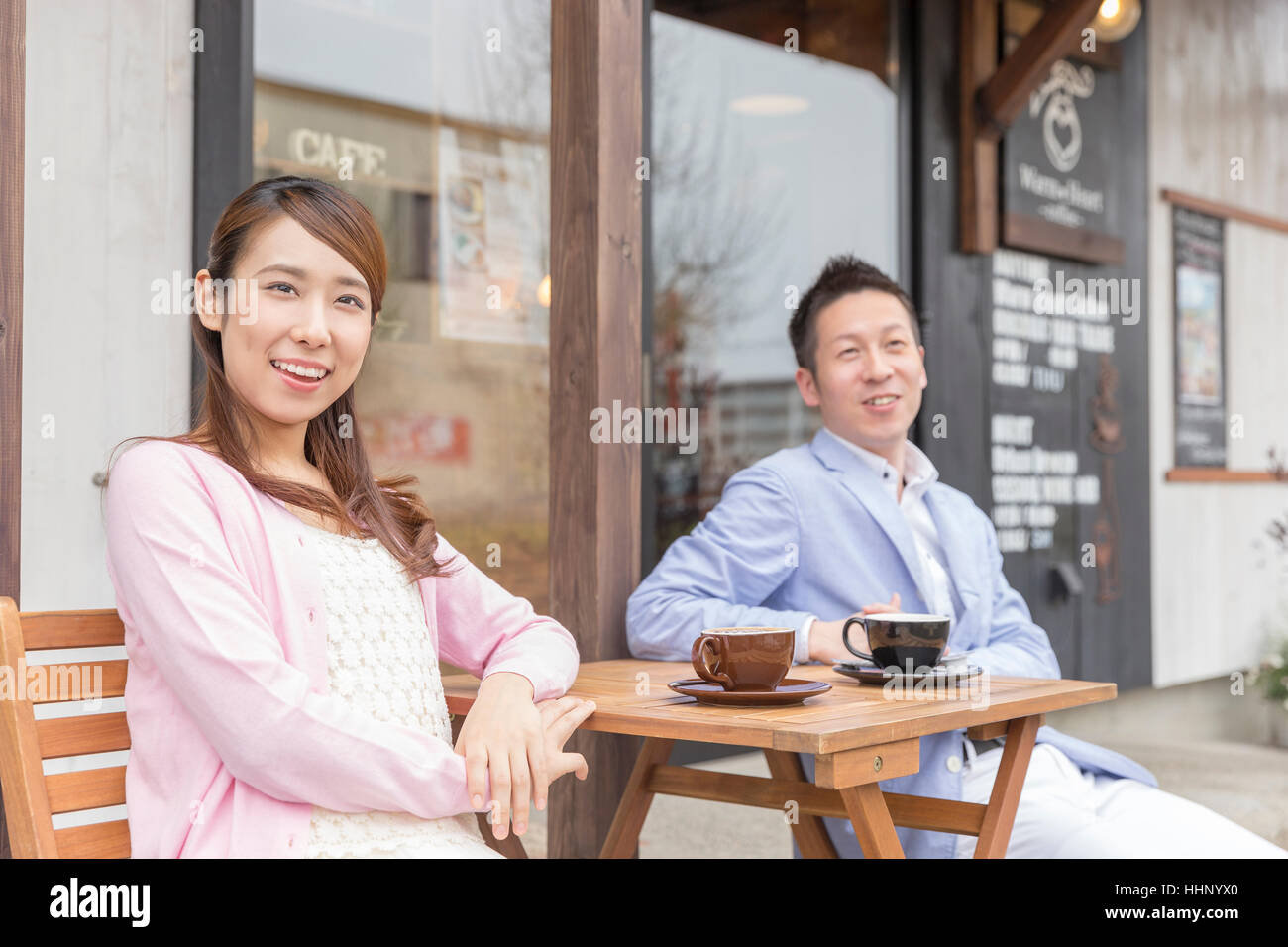 Couple Sitting in Chair with Smile Stock Photo