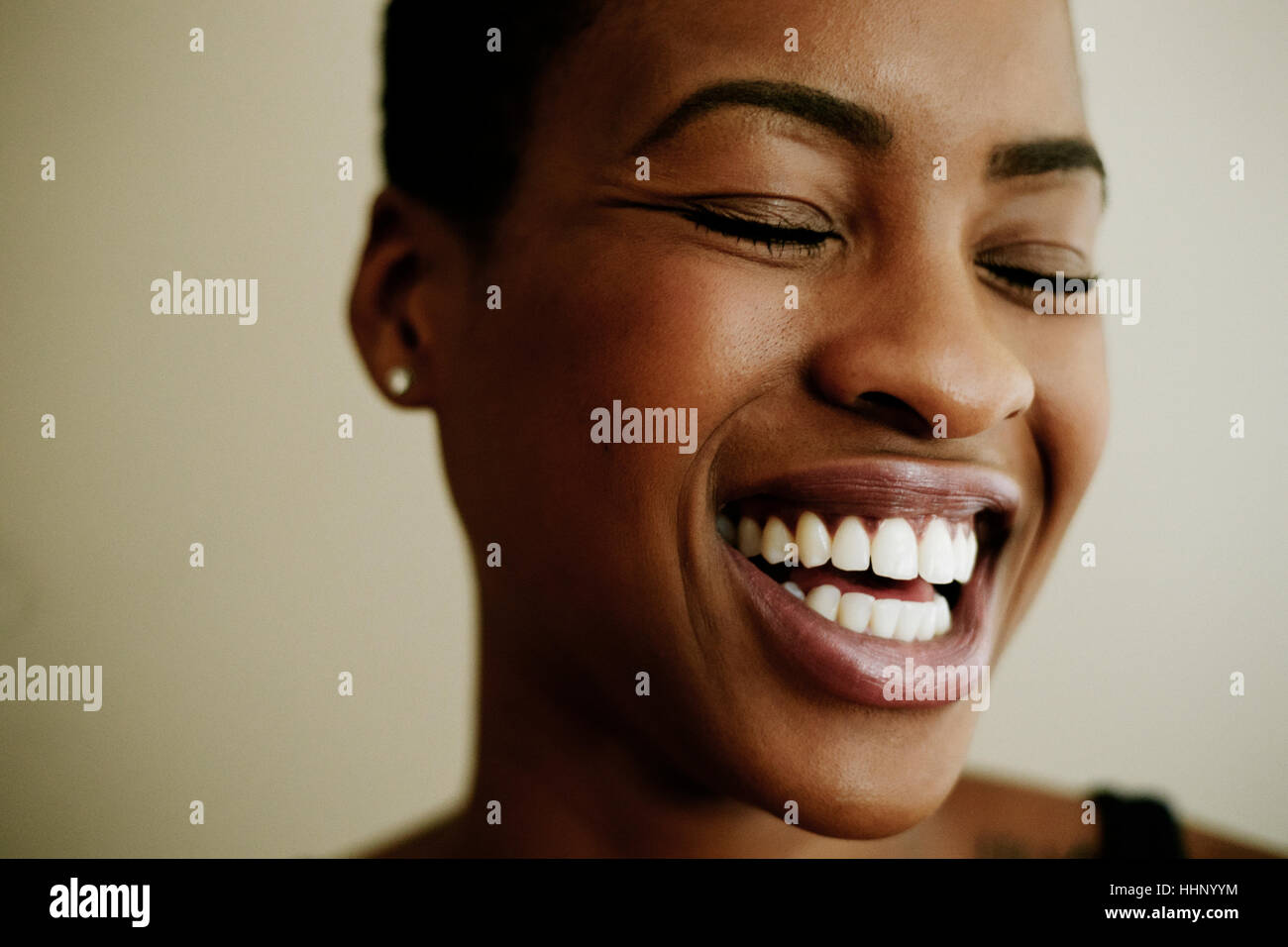 Portrait of face of laughing Black woman Stock Photo