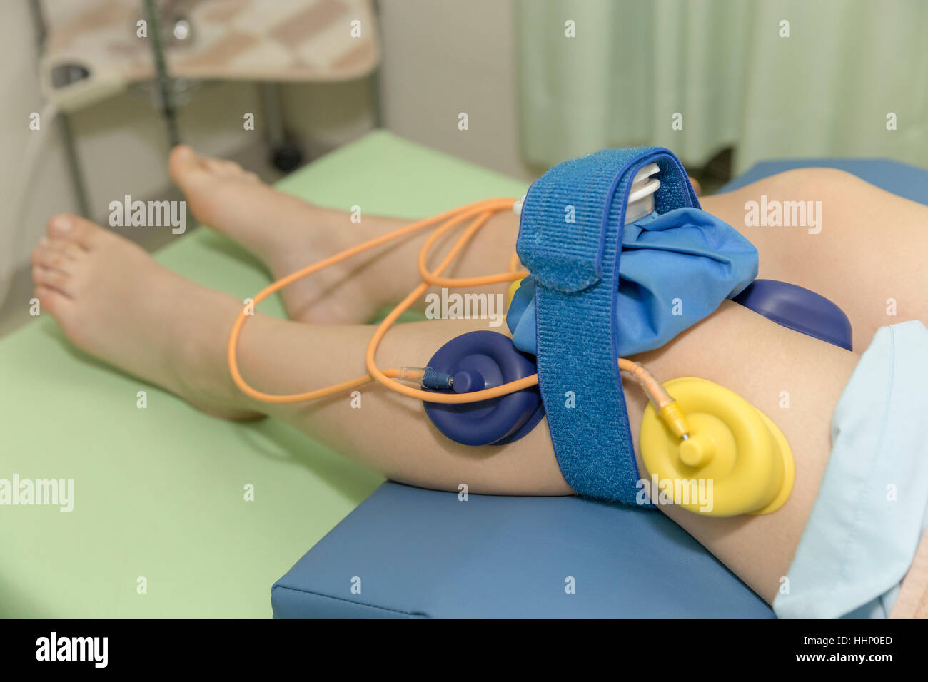 Legs Electrotherapy Performed by Doctor Stock Photo