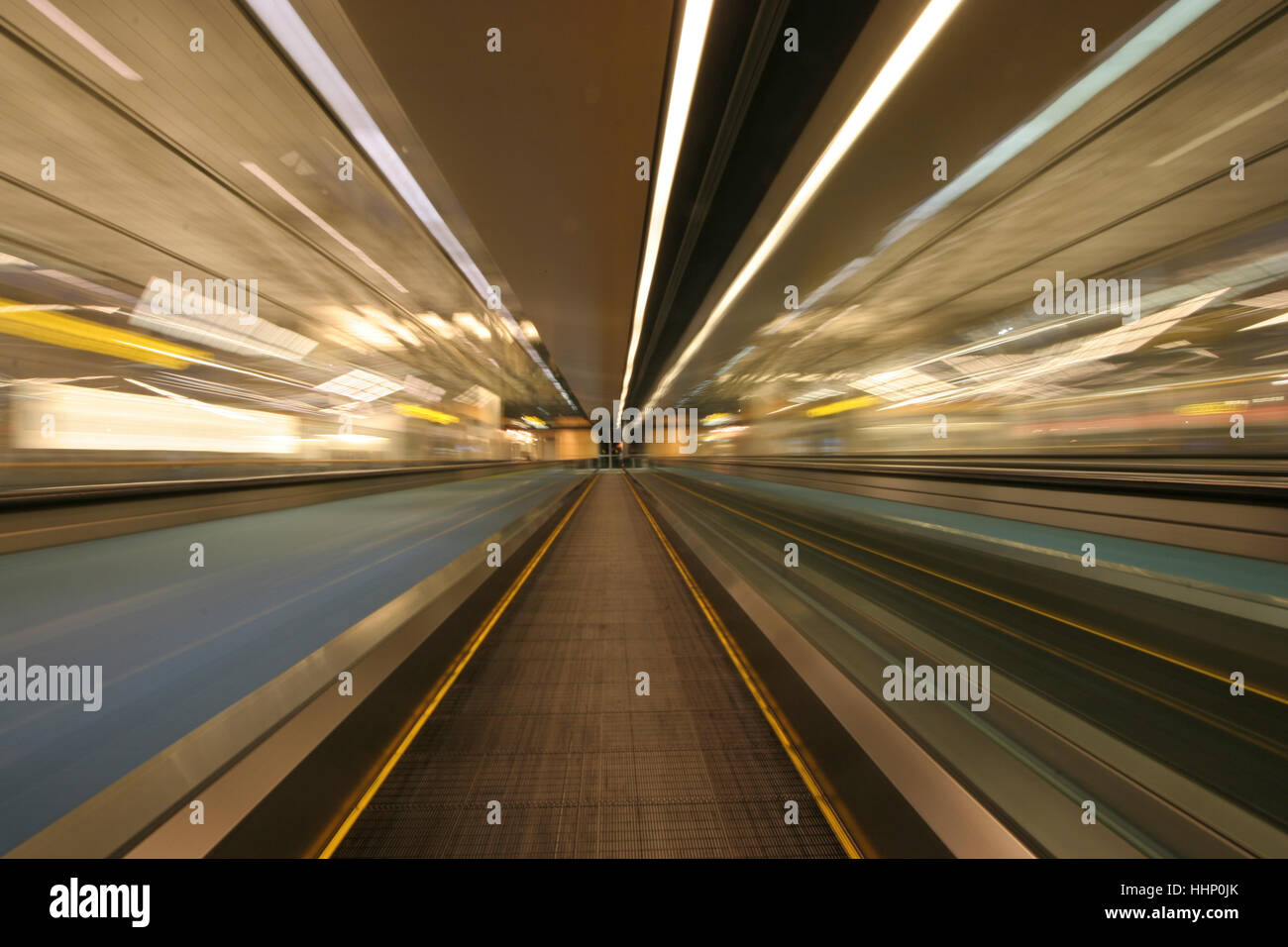 Blurred motion of moving walkway Stock Photo
