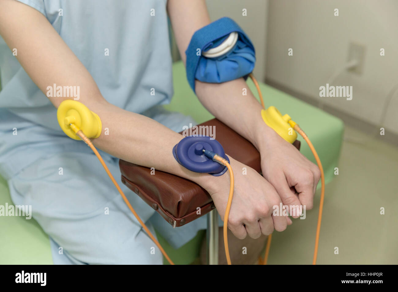 Arms Electrotherapy Performed by Doctor Stock Photo