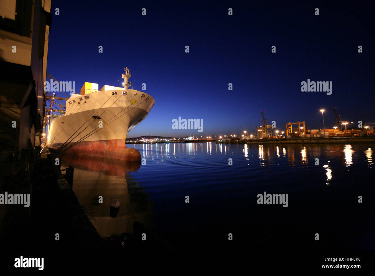 Freighter in port at night Stock Photo