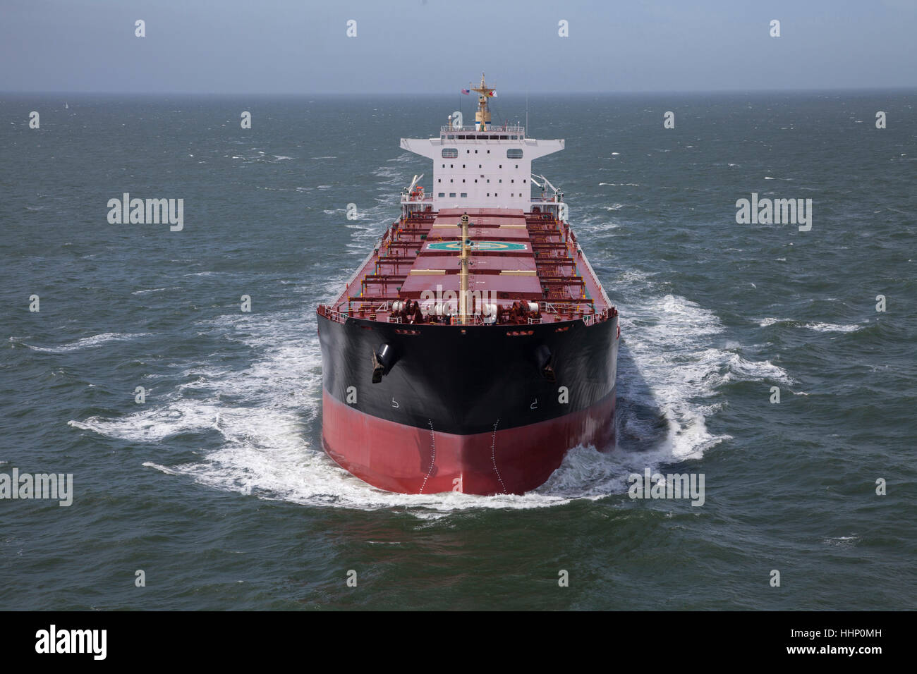 Freighter in ocean Stock Photo