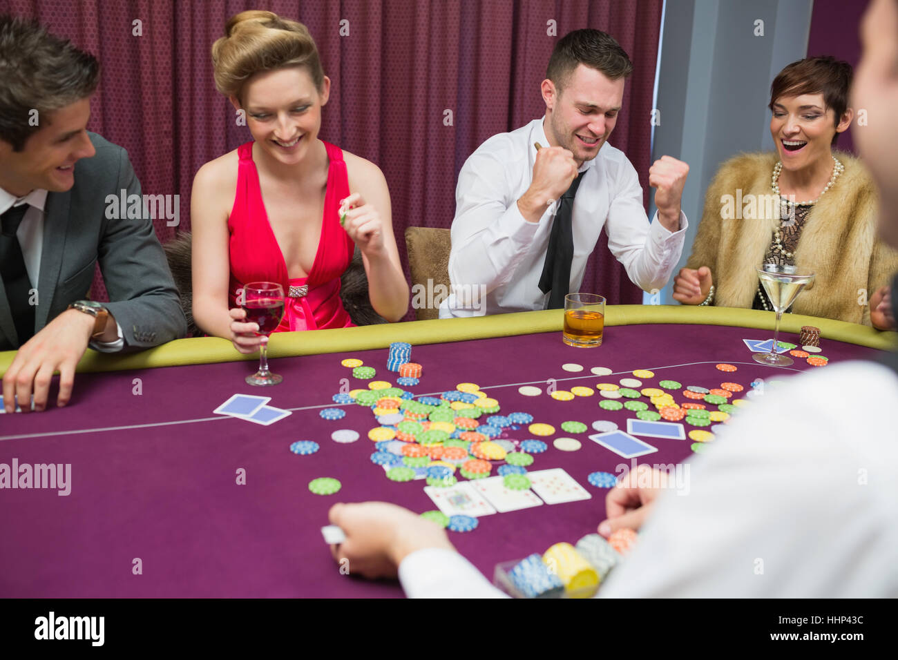 People winning in poker game in casino Stock Photo