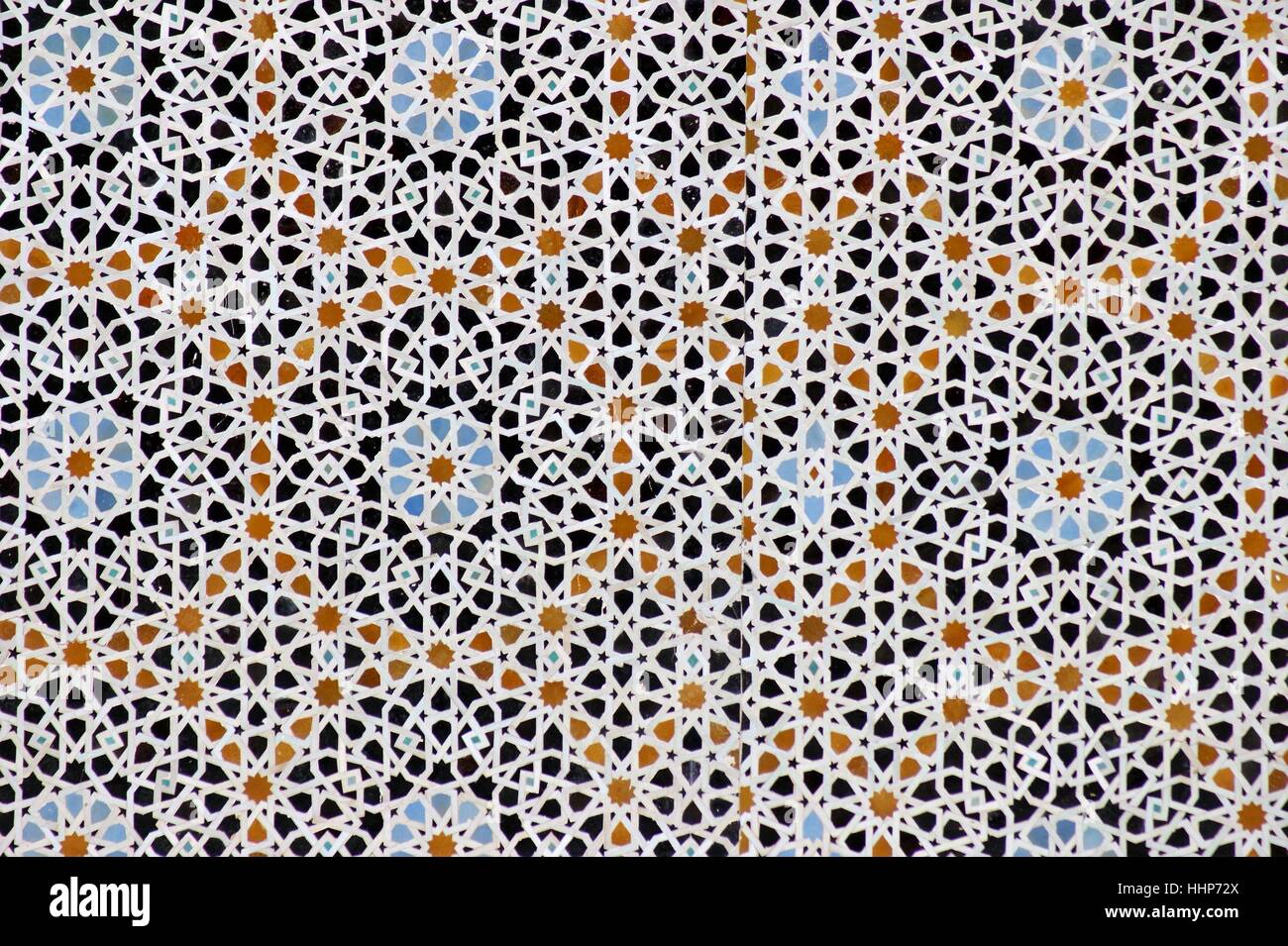 Islamic ceramic geometric tile mosaic design on a building in Fez, Morocco. Stock Photo
