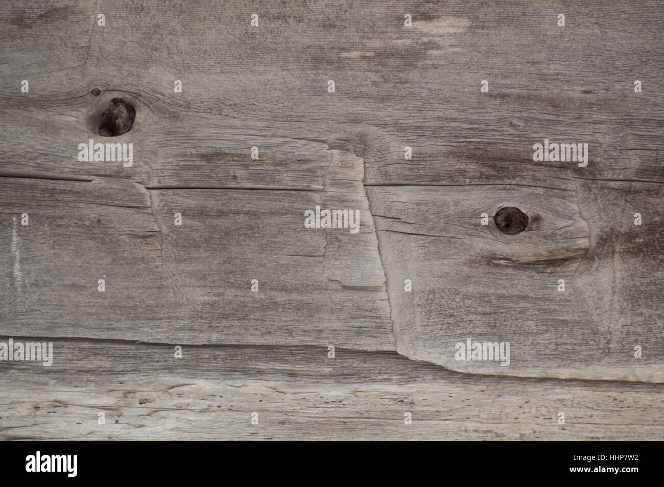 Old log cabin wood timber closeup with wood grain and adze marks. Background Stock Photo
