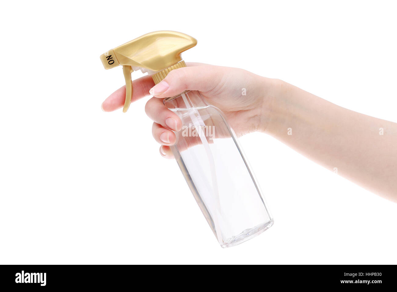 Hand holding spray perfume plastic bottle on white background Stock Photo