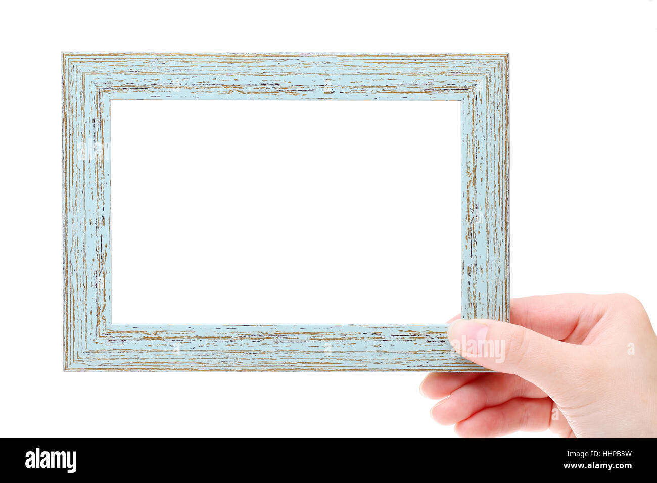 Hand holding wooden picture frame on white background Stock Photo Alamy