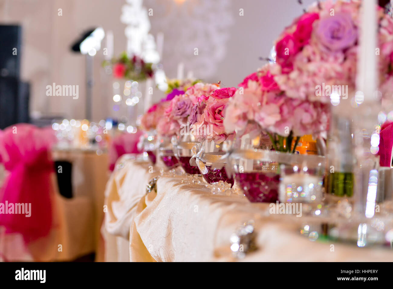 Arrangements with pink flowers on the table light side Stock Photo