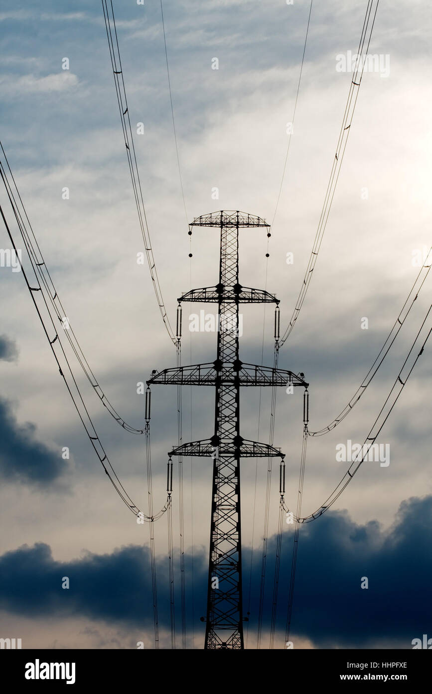 High voltage electric tower against stormy sky Stock Photo - Alamy