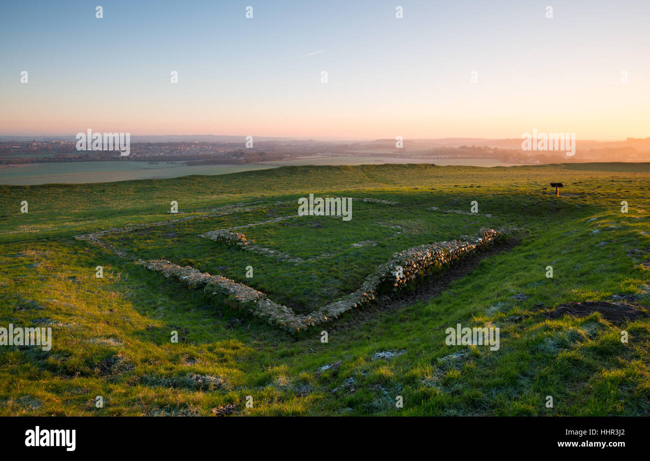 Maiden Castle near Dorchester, Dorset, UK. 20th January 2017. Crisp colourful sunrise at Madien Castle with the ruins of an old chapel built around tyhe 4th century AD. © Dan Tucker/Alamy Live News Stock Photo