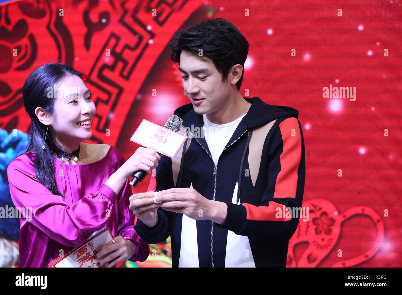 Shenyan, Shenyan, China. 20th Jan, 2017. Shenyang, CHINA-January 20 2017: (EDITORIAL USE ONLY. CHINA OUT) Chinese actor Lin Gengxin makes dumplings during the promotional event.Chinese famous film director Tsui Hark and actor Lin Gengxin promote their latest film 'Journey to the West: The Demons Strike Back' in Shenyang, capital of northeast China's Liaoning Province, January 20th, 2017. Credit: SIPA Asia/ZUMA Wire/Alamy Live News Stock Photo