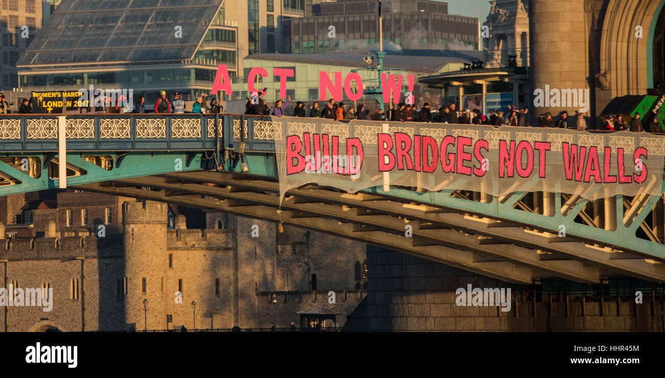 London, UK. 20 January, 2017. On the eve of Donald Trumps inauguration as the 45th President of the United States of America, and in defiance of his politics of hate and division, ’Bridges not walls’ dropped banners from many bridges around the World including the iconic Tower Bridge in London. David Rowe/Alamy Live News Stock Photo