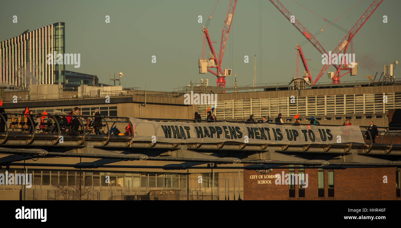 London, UK. 20 January, 2017. On the eve of Donald Trumps inauguration as the 45th President of the United States of America, and in defiance of his politics of hate and division, ’Bridges not walls’ dropped banners from many bridges around the World including the iconic Millennium footbridge in London. David Rowe/Alamy Live News Stock Photo