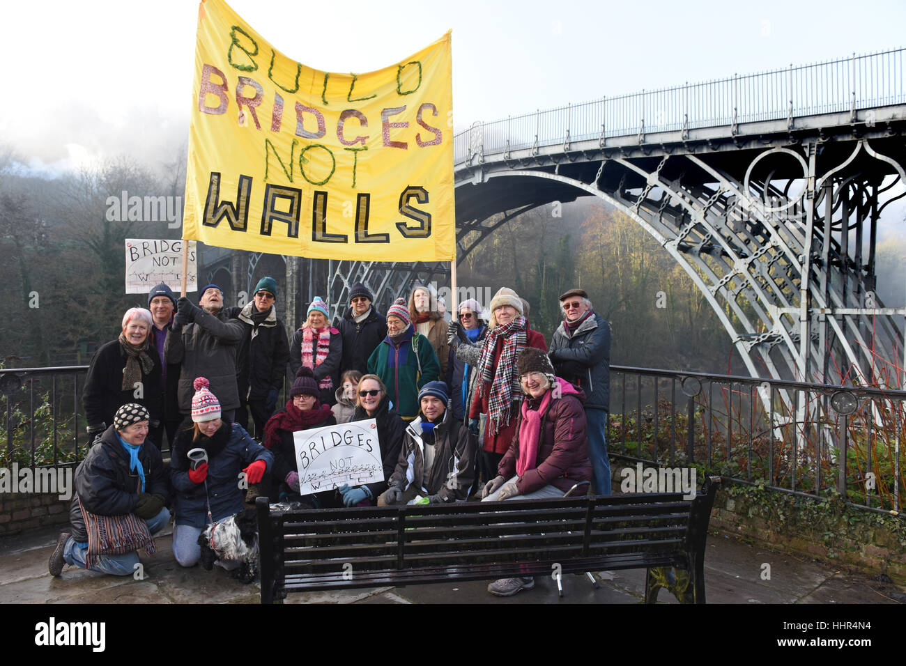 Build Bridges not Walls activists campaigning against the politics of Donald Trump next to the worlds oldest Ironbridge. Credit: David Bagnall Stock Photo